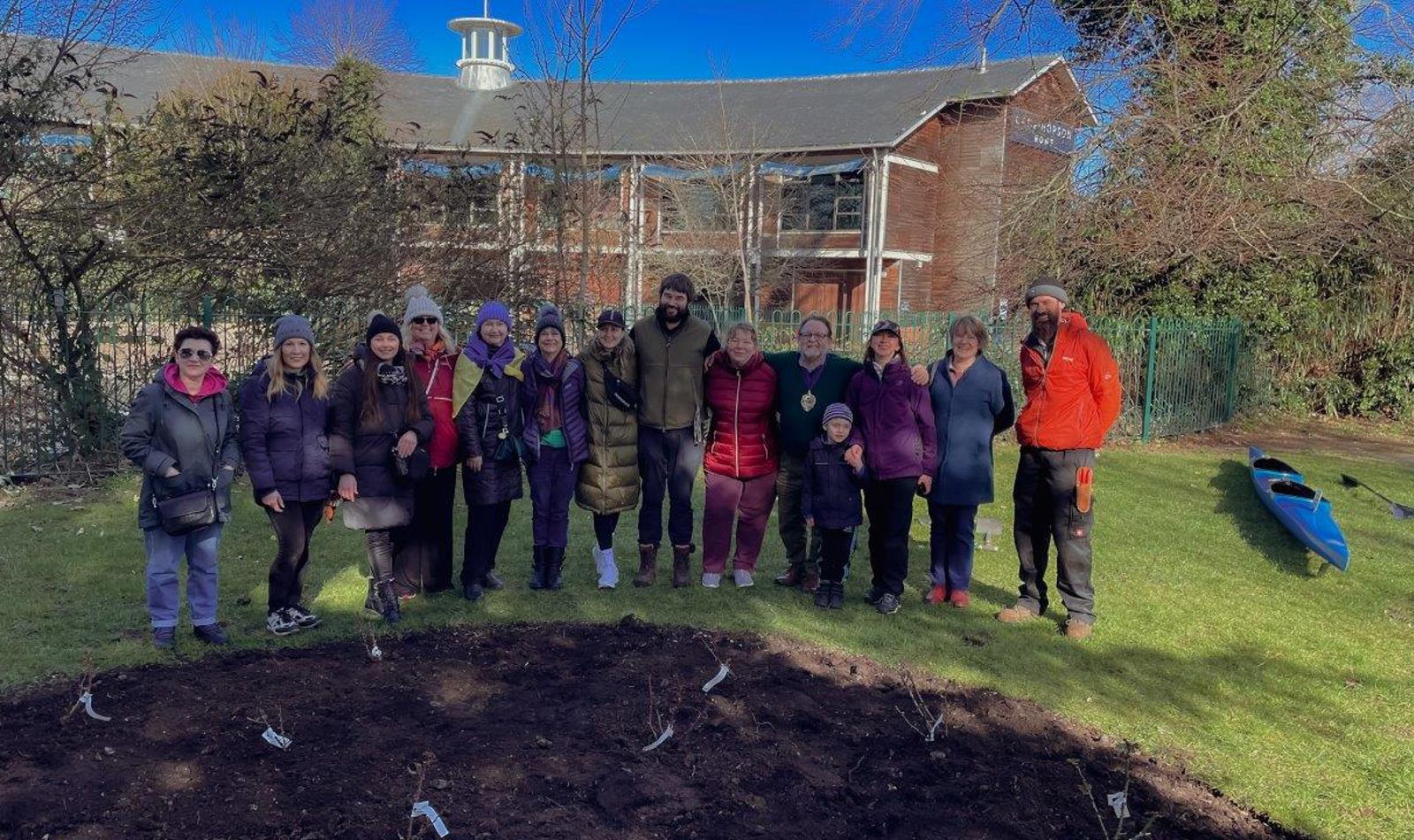 Volunteers Help Plant The Rose Beds At The Peace Gardens 2