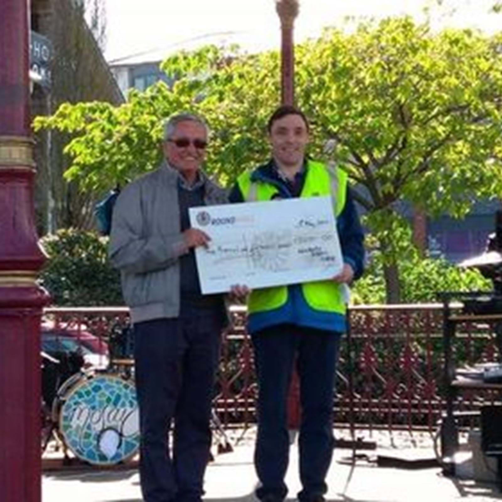 Picture Of Late Marcus Franks Presenting Cheque